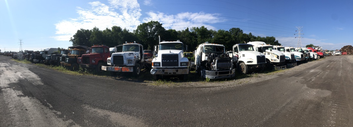 Panoramic view of salvage heavy duty trucks for sale